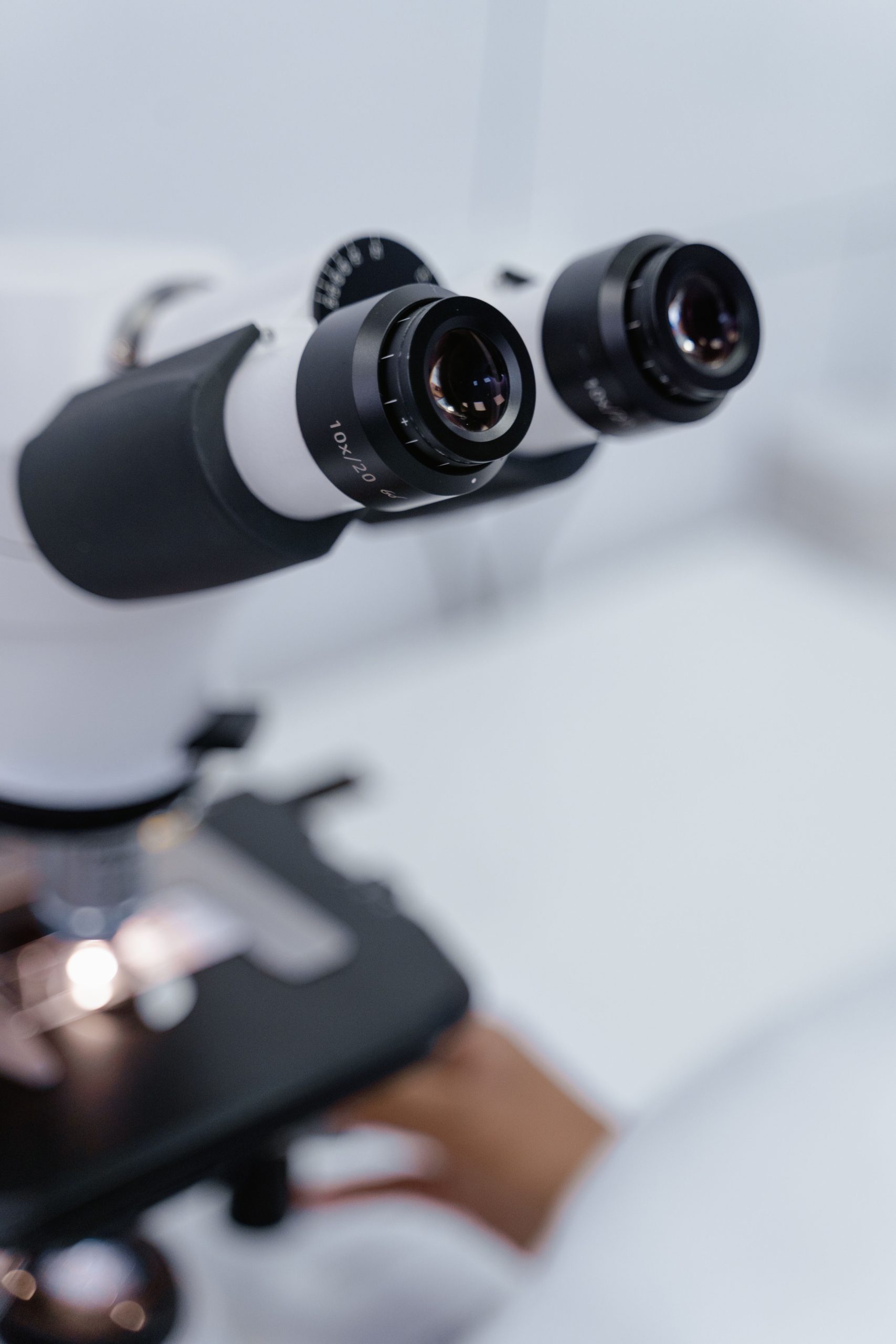 Precision microscope lens in a laboratory, ideal for scientific research visuals.